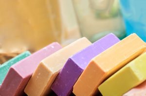 Homemade soaps. Variety of colorful handmade soap bars closeup view. Natural herbal beauty products